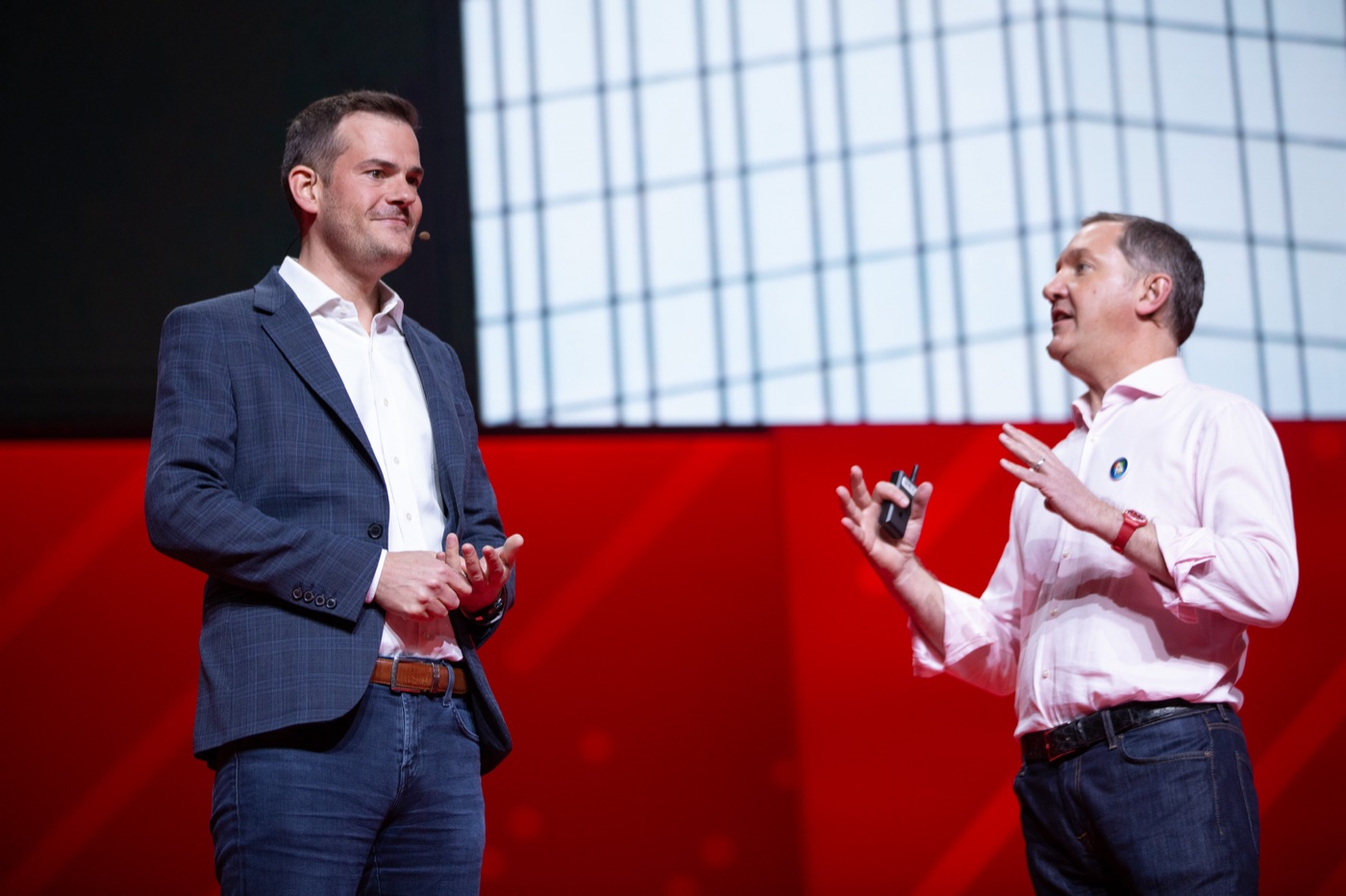 Tom Gilbert on stage at Red Hat Summit 2019 with Jim Whitehurst