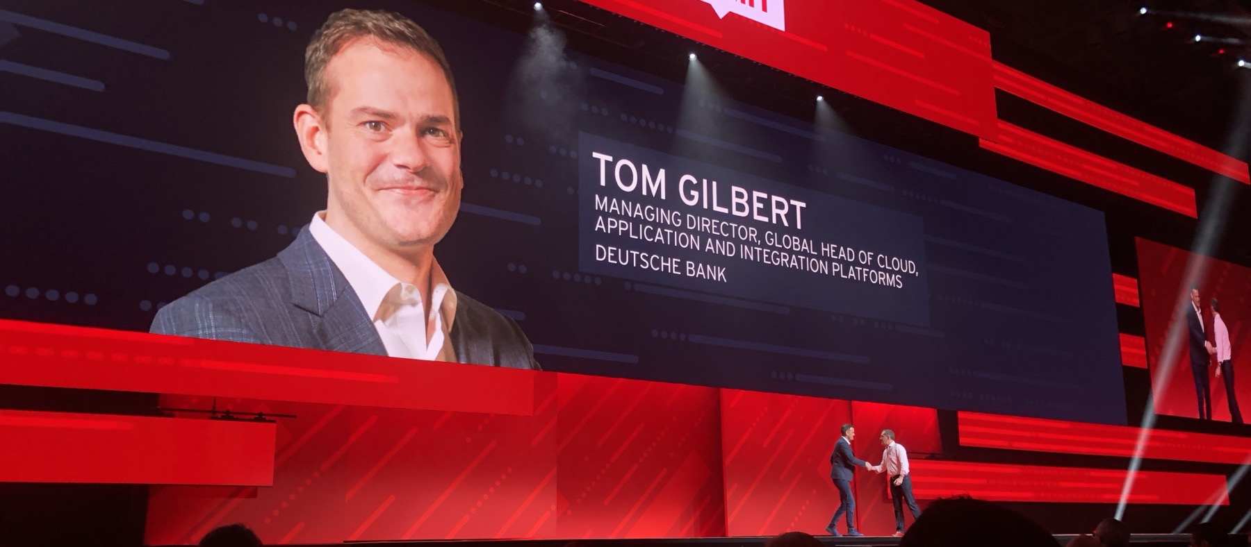 Tom Gilbert doing a keynote at Red Hat Summit with Jim Whitehurst